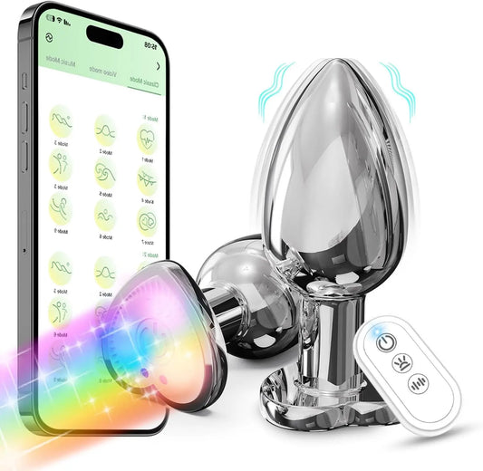 Silver vibrating plug with remote control, smartphone app interface, and rainbow light accent