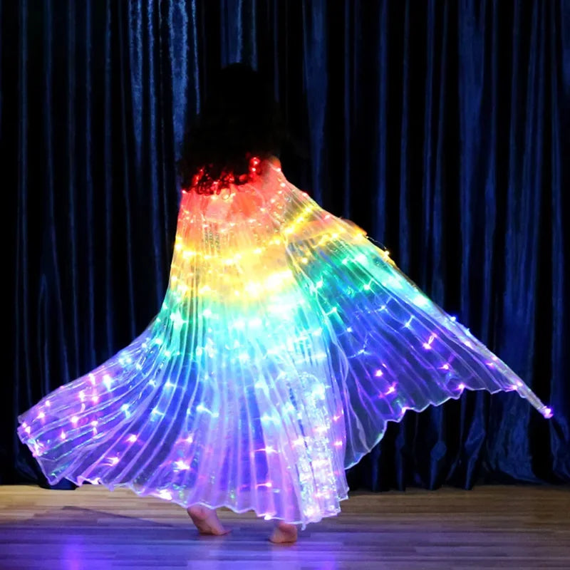 Person wearing illuminated rainbow LED wings for dance performance on stage