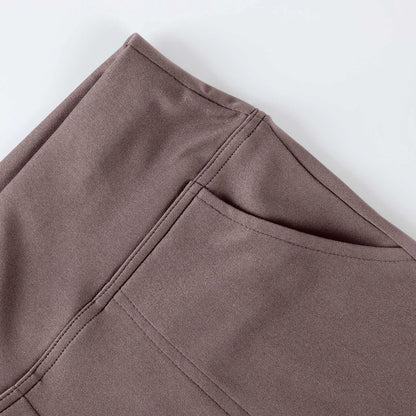 Close-up of taupe stretch fabric pants with stitched pocket detail