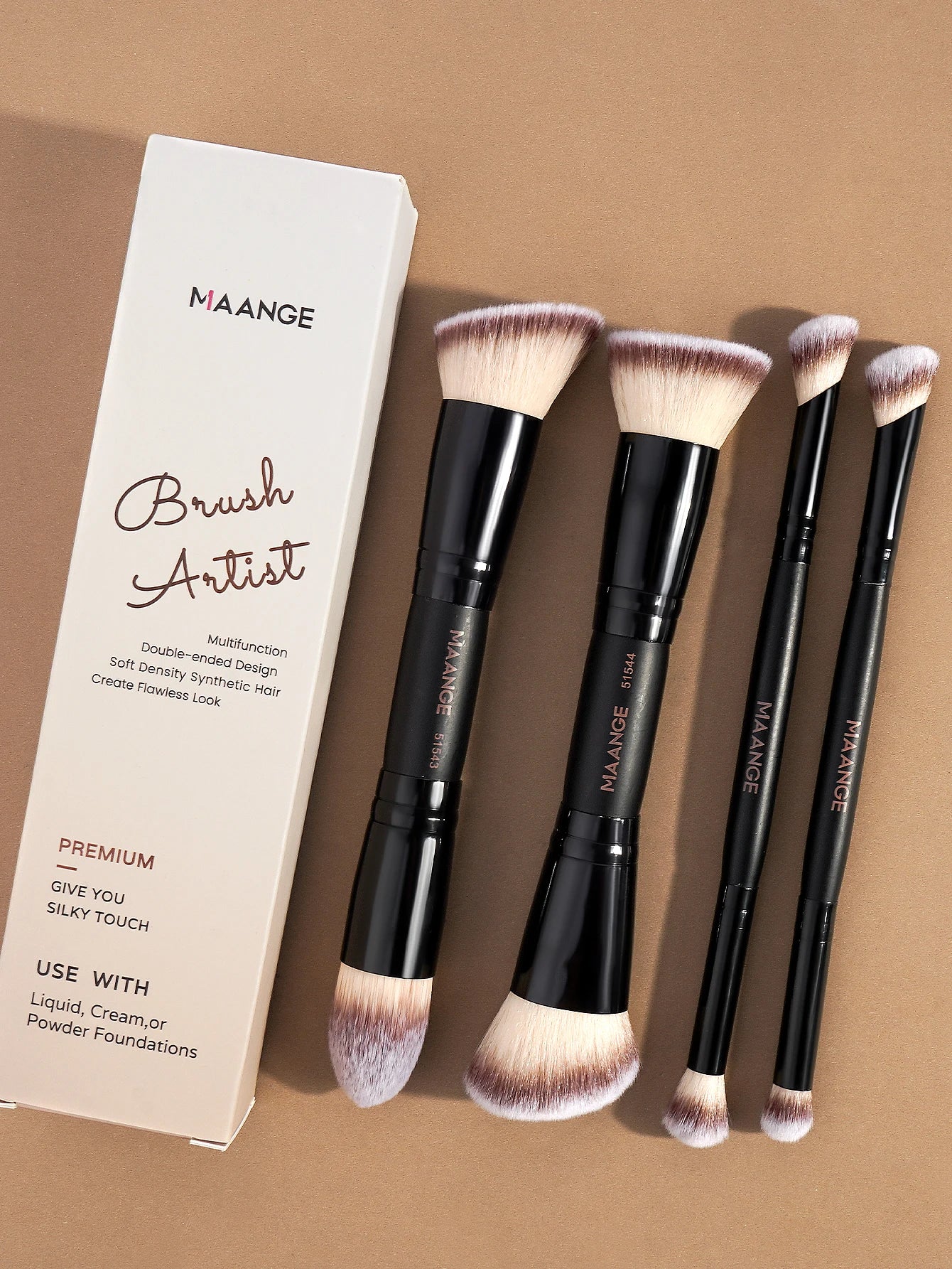 Set of MAANGE double-ended makeup brushes with soft synthetic bristles on brown background