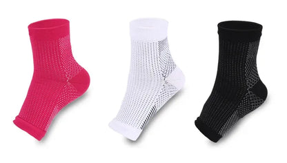 Three pairs of ankle compression socks in pink, white, and black on a white background.
