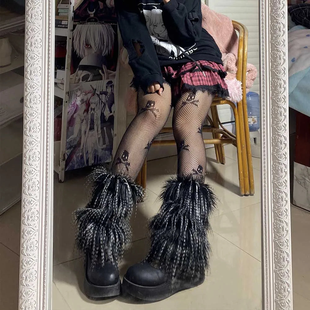Person in mirror selfie wearing furry black platform boots, ripped fishnet tights, plaid skirt, and black sweater.