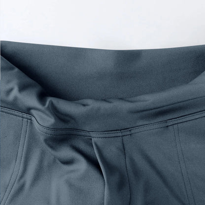 Close-up of grey high-waisted leggings waistband with smooth stretch fabric