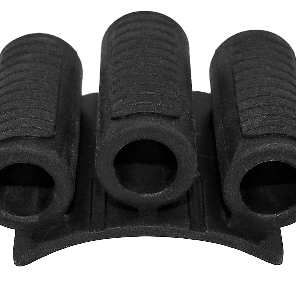 Close-up of black silicone multi-slot cable organizer with three ridged channels