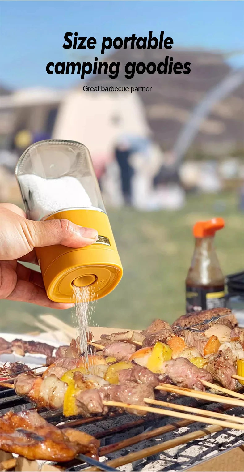 Hand using portable spice shaker to season barbecue skewers on outdoor grill at campsite
