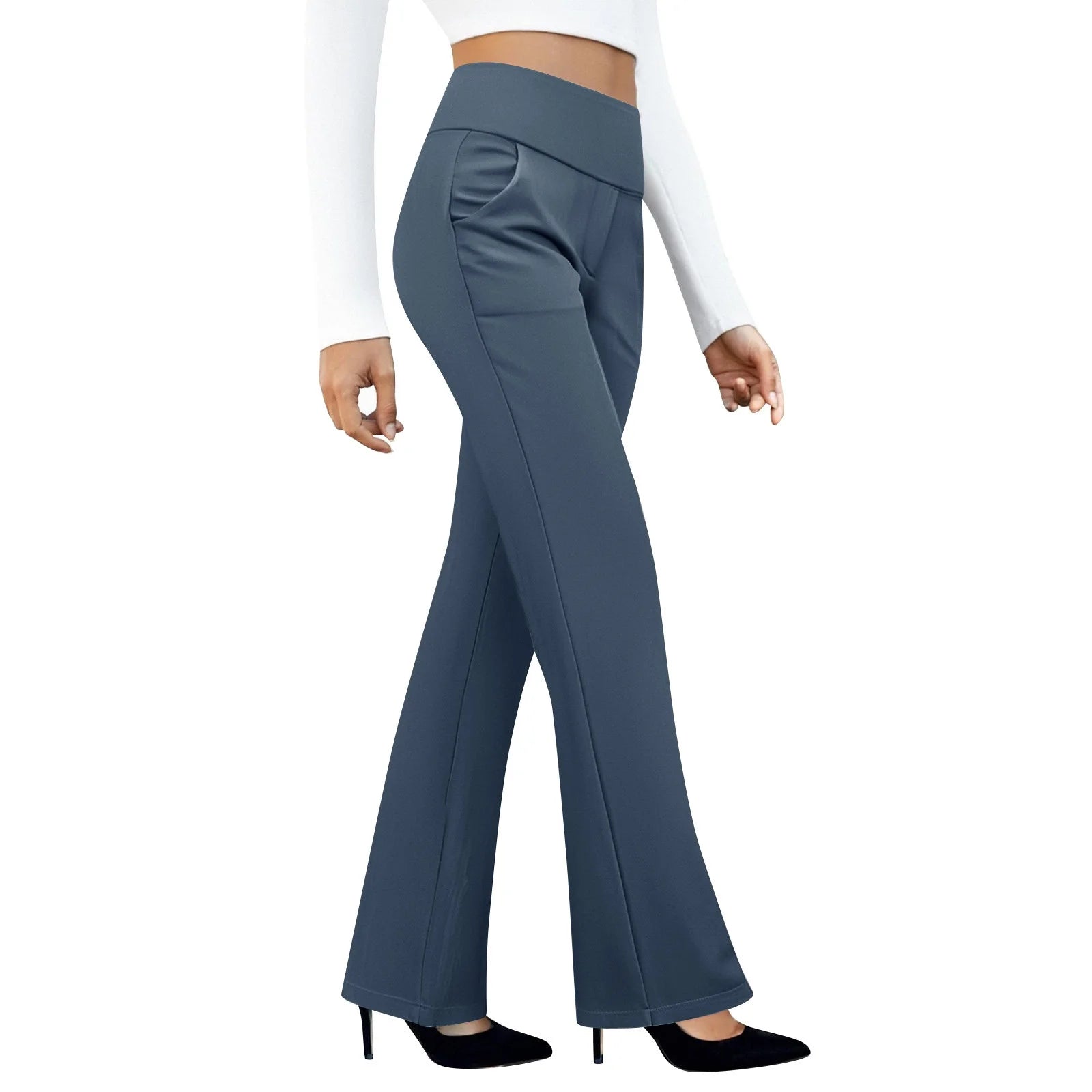 Woman wearing high-waisted blue flared pants and white long sleeve crop top