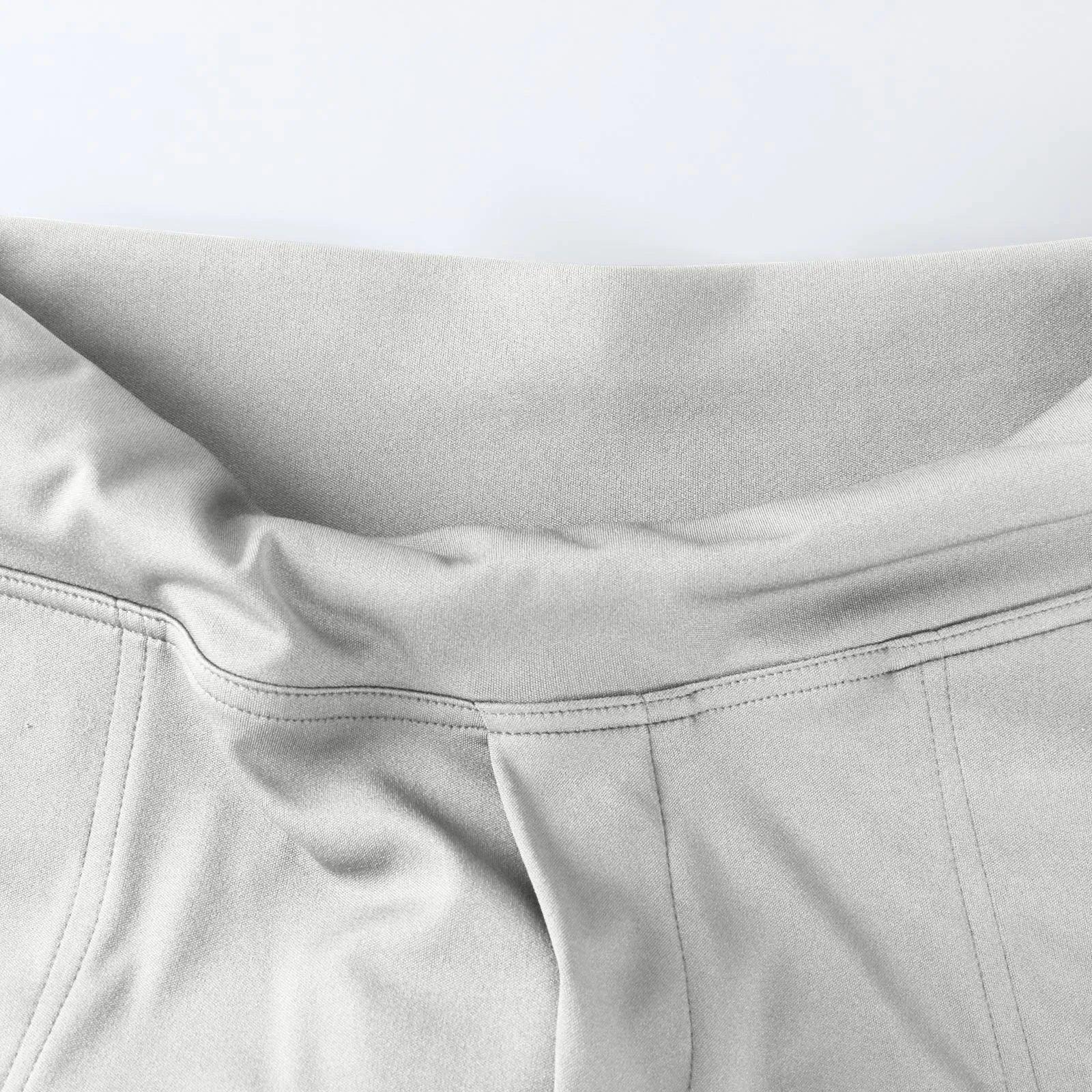 Close-up of light gray elastic waistband lounge pants with soft fabric and stitched seams
