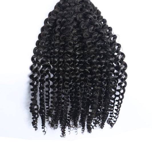 Bundle of black synthetic curly hair extensions on white background