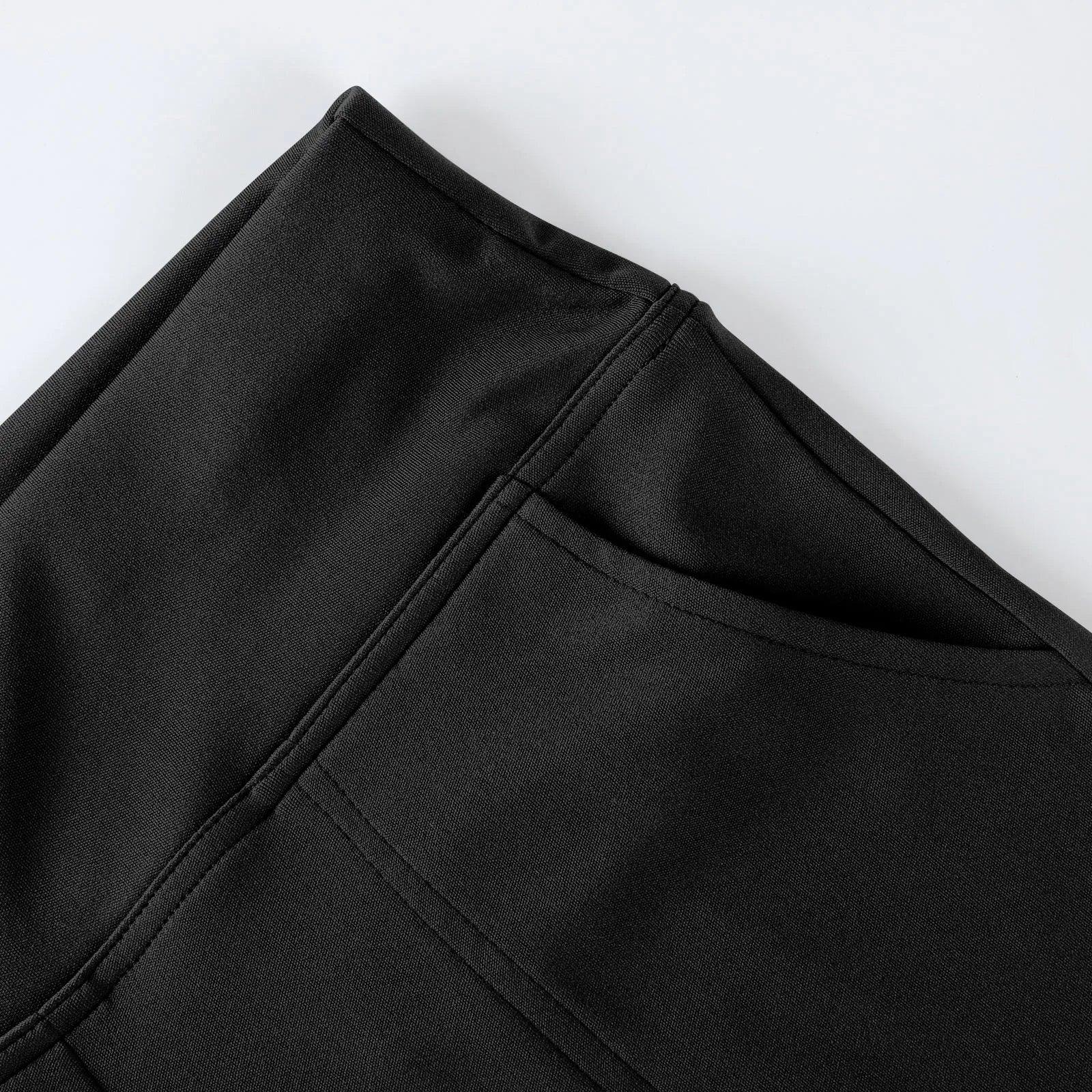 Close-up of black leggings with side pocket, smooth fabric, minimalist design