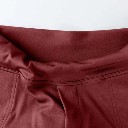 Close-up of maroon high-waisted leggings waistband with flatlock stitching