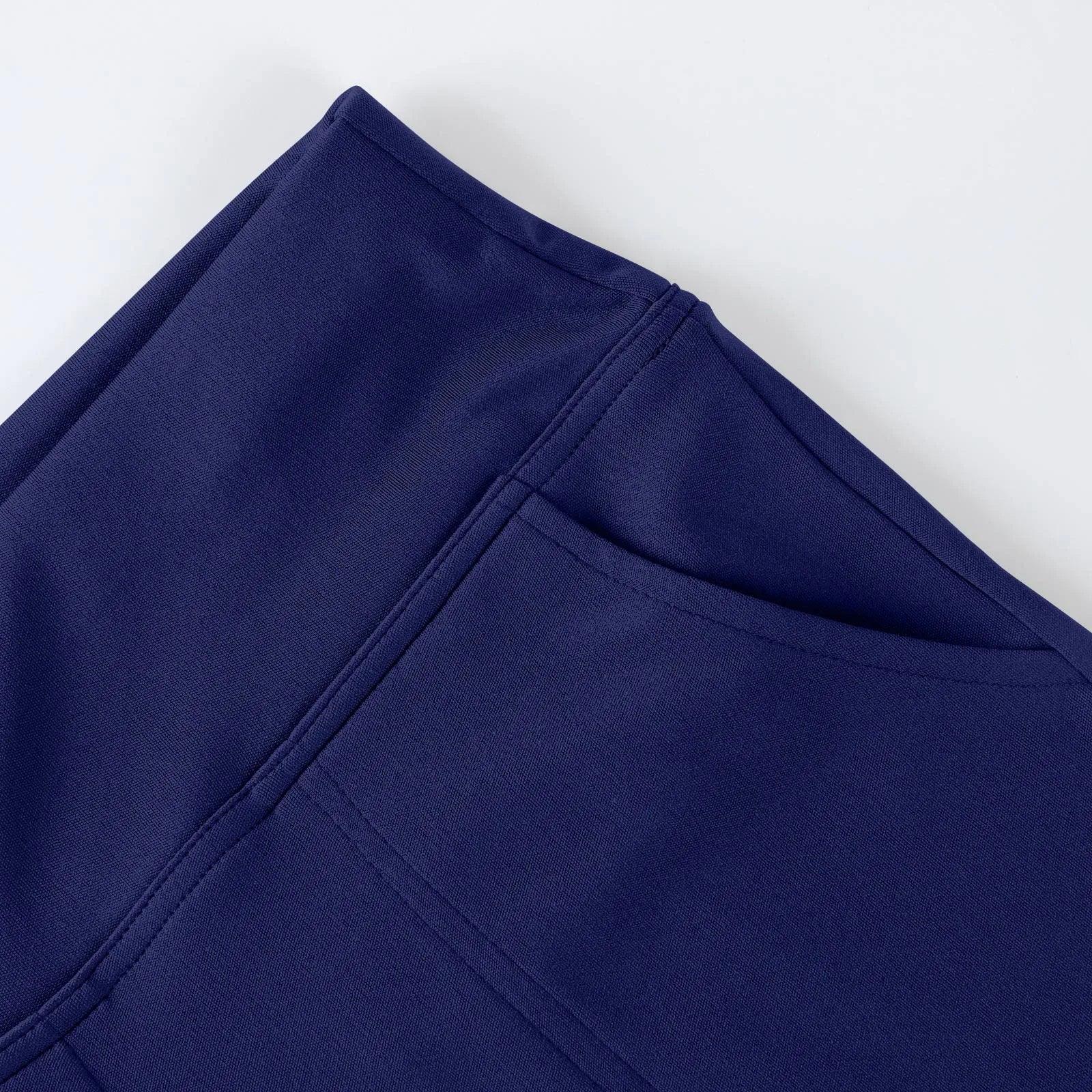 Close-up of navy blue fabric leggings with side pocket, modern activewear detail