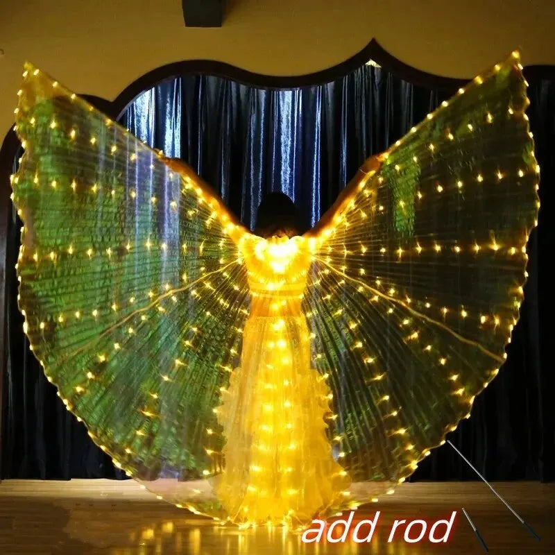 Person wearing illuminated LED angel wings costume with golden lights, stage background