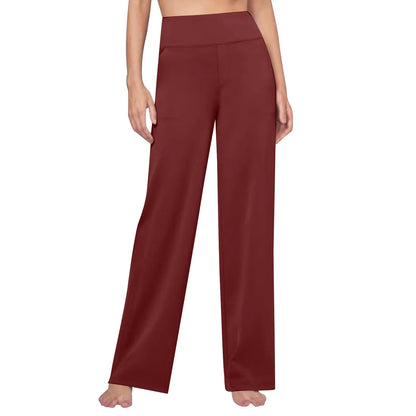 Woman wearing high-waisted wide-leg maroon lounge pants on white background
