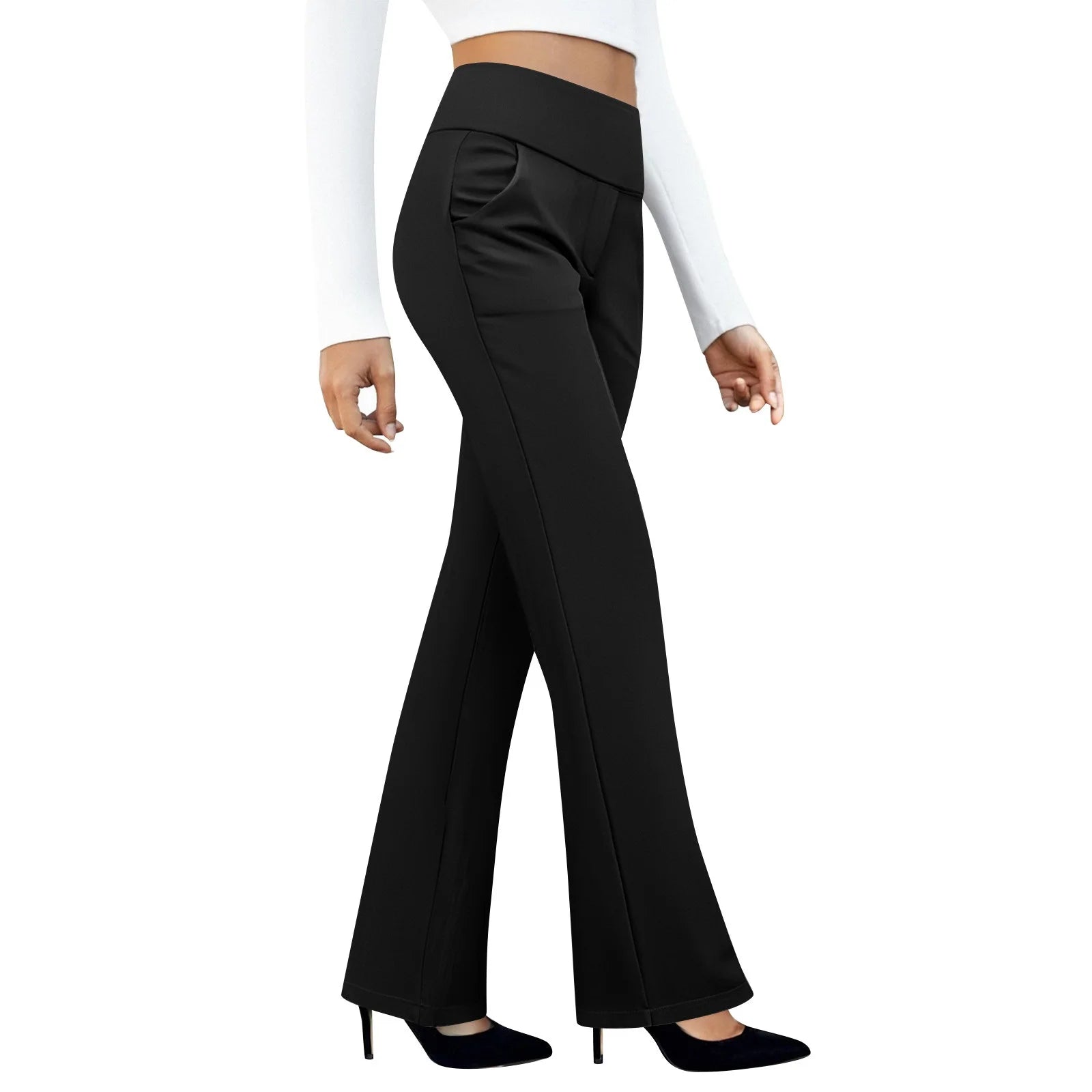 Woman wearing black high-waisted flare pants and black heels, white background