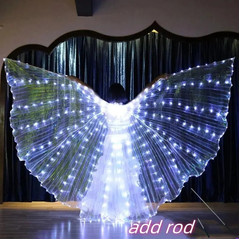 Person wearing large LED light up wings costume with glowing fairy lights indoors