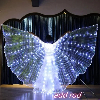 Person wearing large LED light up wings costume with glowing fairy lights indoors