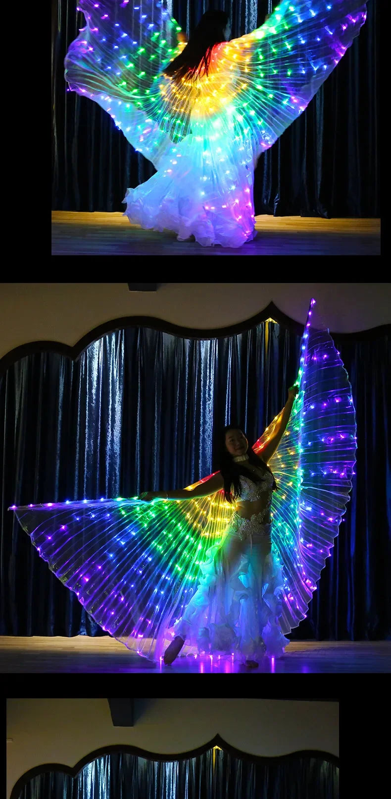 Woman performing on stage with large LED light-up wings and flowing white costume