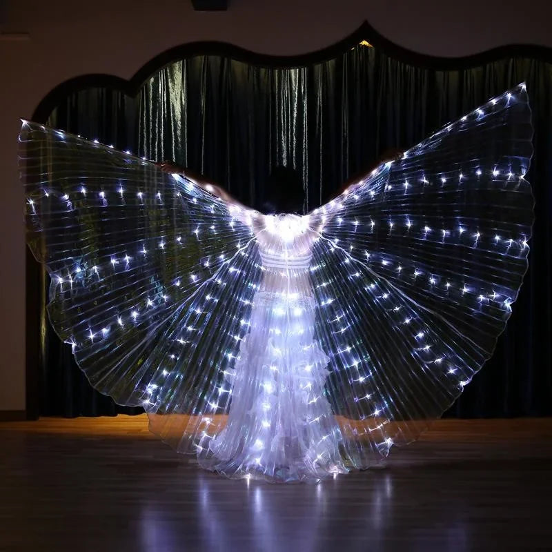 Person wearing illuminated LED butterfly wings costume in dark indoor setting
