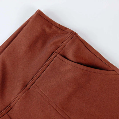 Close-up of brown pants pocket with visible stitching, modern lifestyle apparel detail