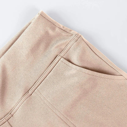 Close-up of beige pants pocket with visible stitching on smooth fabric