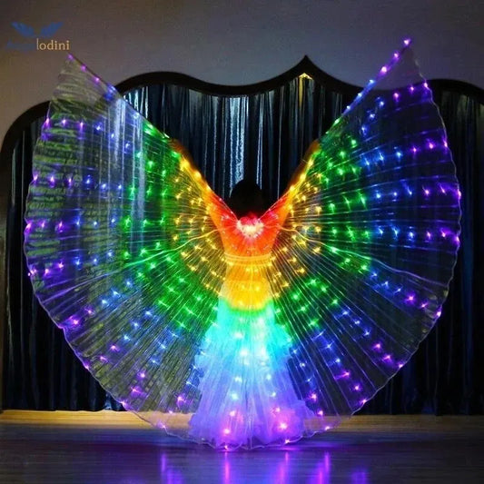 Person wearing illuminated LED wings with vibrant rainbow lights, dance costume on stage