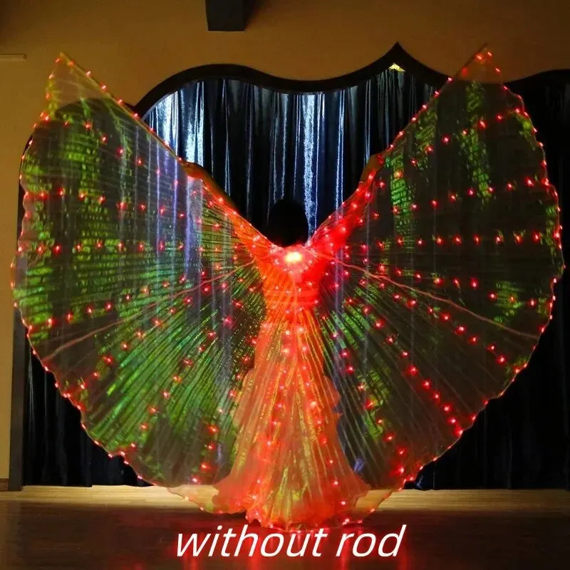 Person wearing large LED light up butterfly wings costume, glowing red and green, on stage