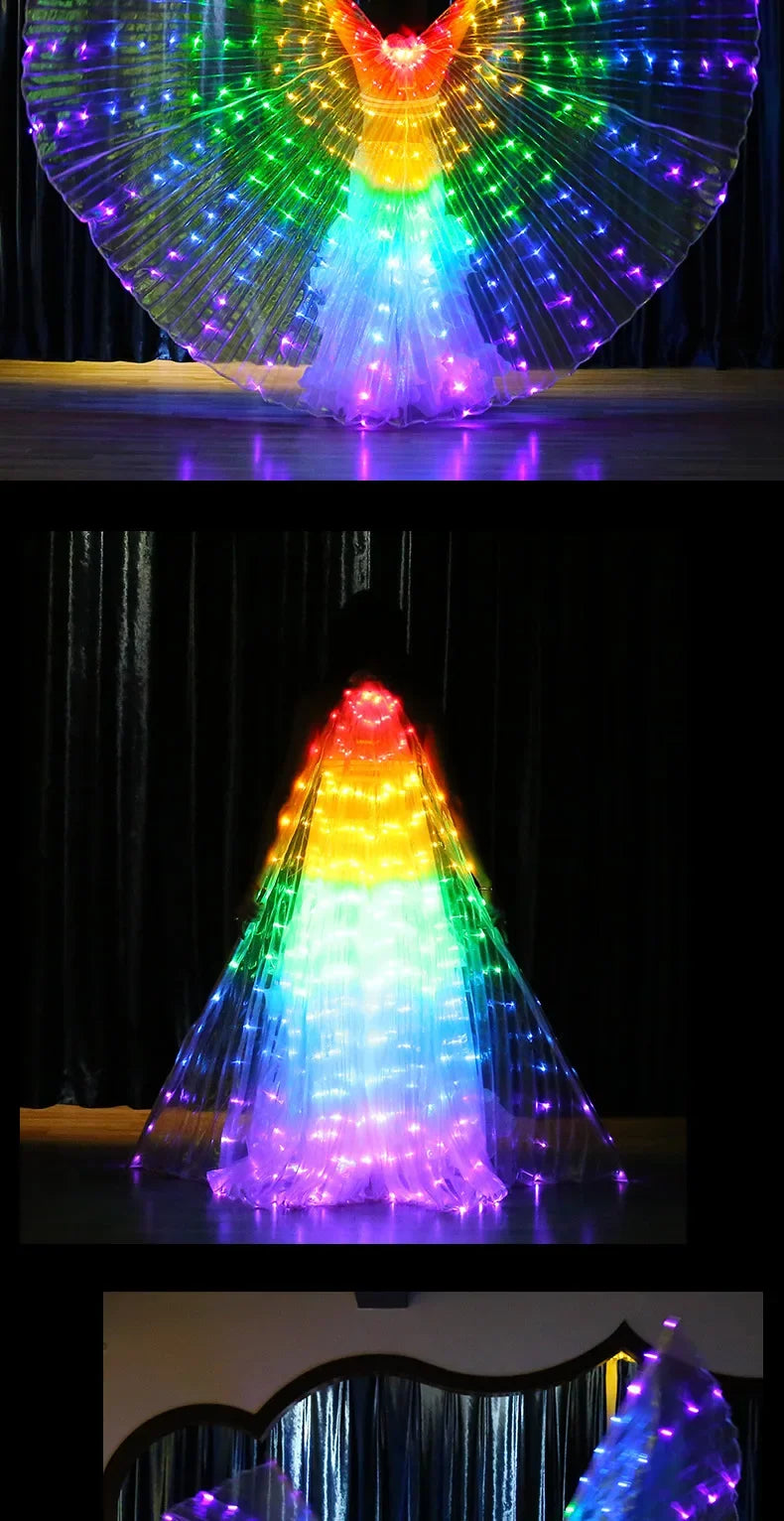Person wearing illuminated LED wings costume with vibrant rainbow lights on stage