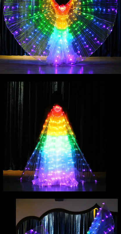 Person wearing illuminated LED wings costume with vibrant rainbow lights on stage
