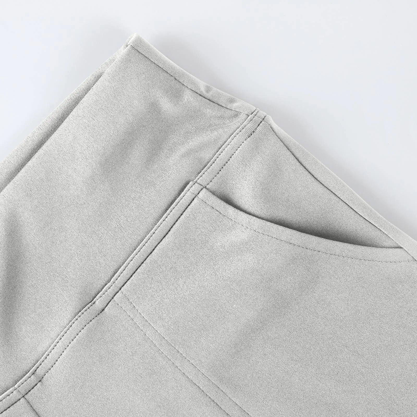 Close-up of a light grey fabric pocket on comfortable pants with clean stitching